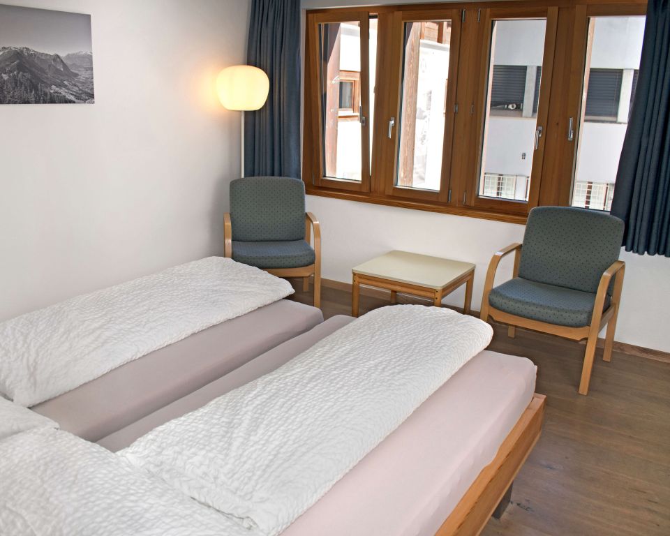 Bright hotel room with two armchairs